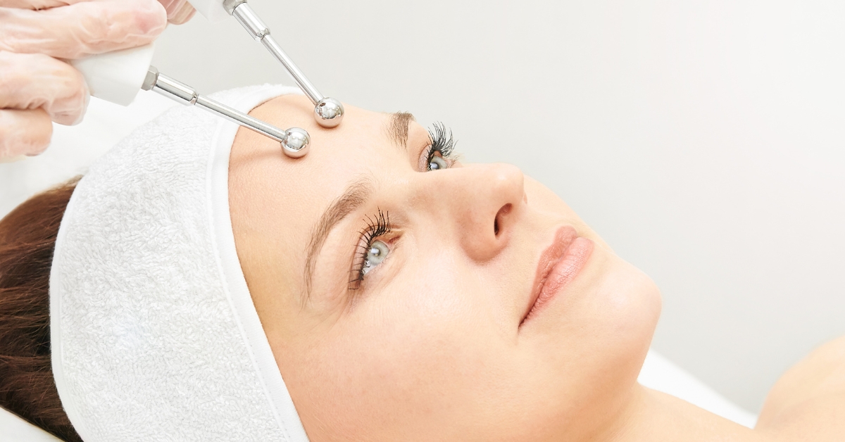 Woman receiving microcurrent facial