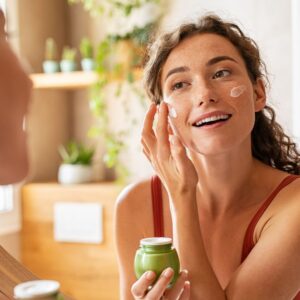 woman performing morning skincare routine