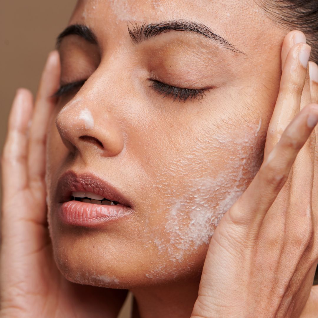 img of a woman washing her face